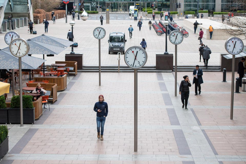 People at lunch time at Canary Wharf, London, as commuters switch to working from home and the public are urged to avoid social contact to prevent the spread of coronavirus.