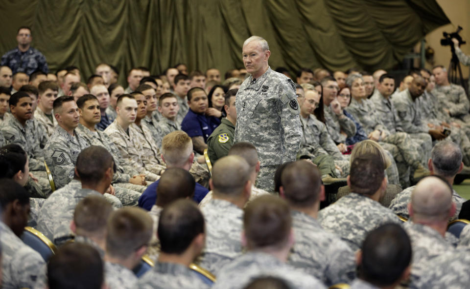 FILE - In this April 25, 2013 file photo, Joint Chiefs Chairman Gen. Martin Dempsey speaks to soldiers of the U.S. Armed Forces in Japan at Yokota Air Base on the outskirts of Tokyo. An Associated Press investigation into the military’s handling of sexual assaults in Japan has found a pattern of random and inconsistent judgments in which most offenders are not incarcerated. Instead, commanders have ordered “nonjudicial punishments” that ranged from docked pay to a letter of reprimand. (AP Photo/Shizuo Kambayashi, File)