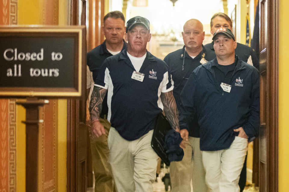 Sept. 11 first responders John Feal, front left, Ret. Lt. Michael O'Connell, front right, and other first responders leave the office of Senate Majority Leader Mitch McConnell, following their meeting at McConnell's office on Capitol Hill in Washington, Tuesday, June 25, 2019. (AP Photo/Manuel Balce Ceneta)