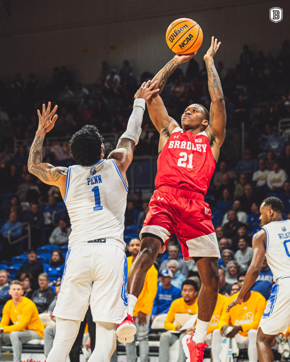 Bradley University point guard Duke Deen shoot over Roman Penn during the Braves 86-61 loss to Drake in a Missouri Valley Conference game at Knapp Center in Des Moines, Iowa on Saturday, Jan. 15, 2023.