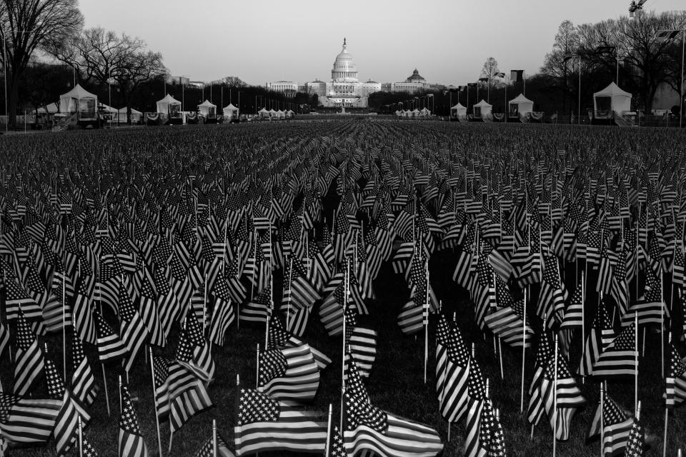 A field of flags on the National Mall in Washington, D.C., on Jan. 19, one day before the inauguration of President-elect Joe Biden and Vice President-elect Kamala Harris. The public art display features nearly 200,000 flags, representing Americans who would have gathered for the inauguration, according to the organizing committee.<span class="copyright">Philip Montgomery for TIME</span>