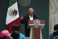 Mexico's President Andres Manuel Lopez Obrador addresses family members of 43 missing students from the Rural Normal School of Ayotzinapa, during a presentation of the ongoing investigations on the sixth anniversary of the students’ enforced disappearance, at the National Palace in Mexico City, Saturday, Sept. 26, 2020. (AP Photo/Rebecca Blackwell)