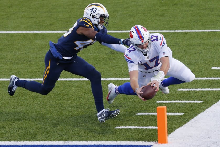 Buffalo Bills quarterback Josh Allen (17) scores a touchdown on a run against Los Angeles Chargers.
