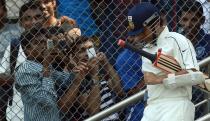 Indian cricketer Sachin Tendulkar walks in to bat for his state team during the Ranji Trophy match between Mumbai and Railways at the Wankhede stadium in Mumbai on November 2, 2012. Tendulkar made a rare appearance in domestic four-day cricket Ranji trophy game to gain match practice ahead of the home Test series against England. The 39-year-old, the world's leading scorer in both Test and one-day cricket, whose last Ranji appearance was in 2009, struggled in a home Test series against New Zealand in August-September when he scored just 63 runs in three innings. AFP PHOTO/ INDRANIL MUKHERJEE