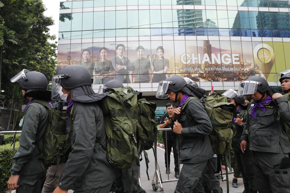 Police arrive outside the German Embassy in central Bangkok, Thailand, Monday, Oct. 26, 2020. Thai royalists gathered outside the embassy to defend pro-democracy protesters' contention that King Maha Vajiralongkorn spends much of his time in Germany conducting Thai political activities. German government officials have recently expressed concern over political activities the king might be conducting on the Germany's soil. (AP Photo/Gemunu Amarasinghe)