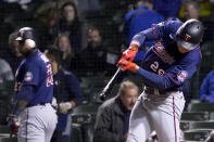 Minnesota Twins' Max Kepler hits a home run off Chicago Cubs starting pitcher Kyle Hendricks during the fourth inning of a baseball game Wednesday, Sept. 22, 2021, in Chicago. (AP Photo/Charles Rex Arbogast)