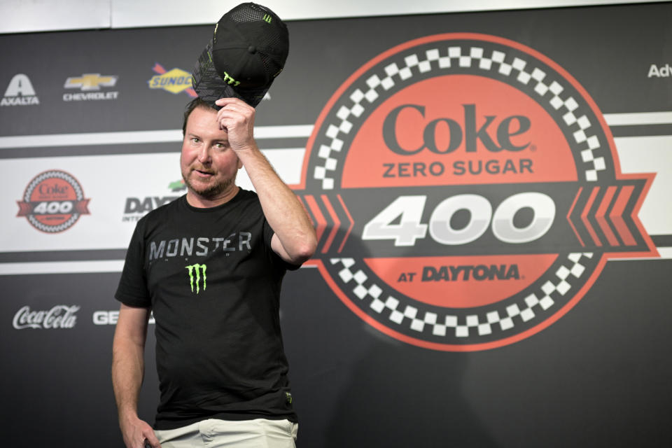 Kurt Busch tips his hat to reporters during a media availability after announcing his retirement before a NASCAR Cup Series auto race at Daytona International Speedway, Saturday, Aug. 26, 2023, in Daytona Beach, Fla. (AP Photo/Phelan M. Ebenhack)