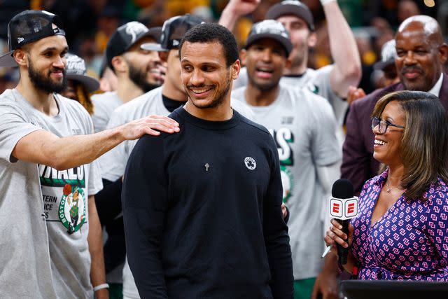 <p>Danielle Parhizkaran/The Boston Globe/Getty</p> Joe Mazzulla smiles after Game 4 of the 2024 Eastern Conference Finals.