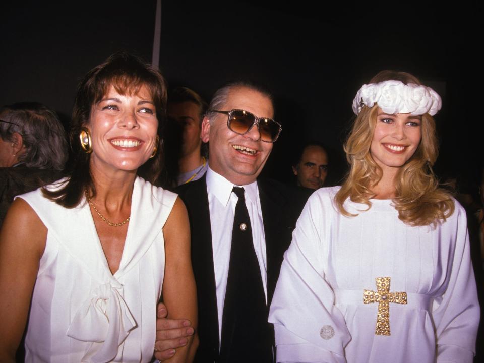 Caroline of Monaco, Karl Lagerfeld, and Claudia Schiffer laugh while looking off camera