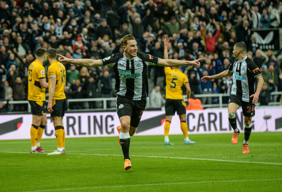 NEWCASTLE UPON TYNE, ENGLAND - APRIL 08: Chris Wood of Newcastle United (20) celebrates after scoring the opening goal only to be disallowed for an offside ruling via VAR during the Premier League match between Newcastle United and Wolverhampton Wanderers at St.James' Park on April 08, 2022 in Newcastle upon Tyne, England. (Photo by Serena Taylor/Newcastle United via Getty Images)