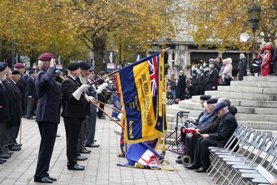 Veterans, military personnel, youth groups and members of the public stand silent as a mark of respect (Andrew Matthews/PA) (PA Wire)