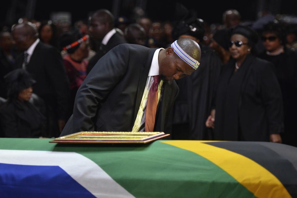 Mandla Mandela, grandson of former South African President Nelson Mandela looks at coffin of Nelson Mandela during his funeral ceremony in Qunu