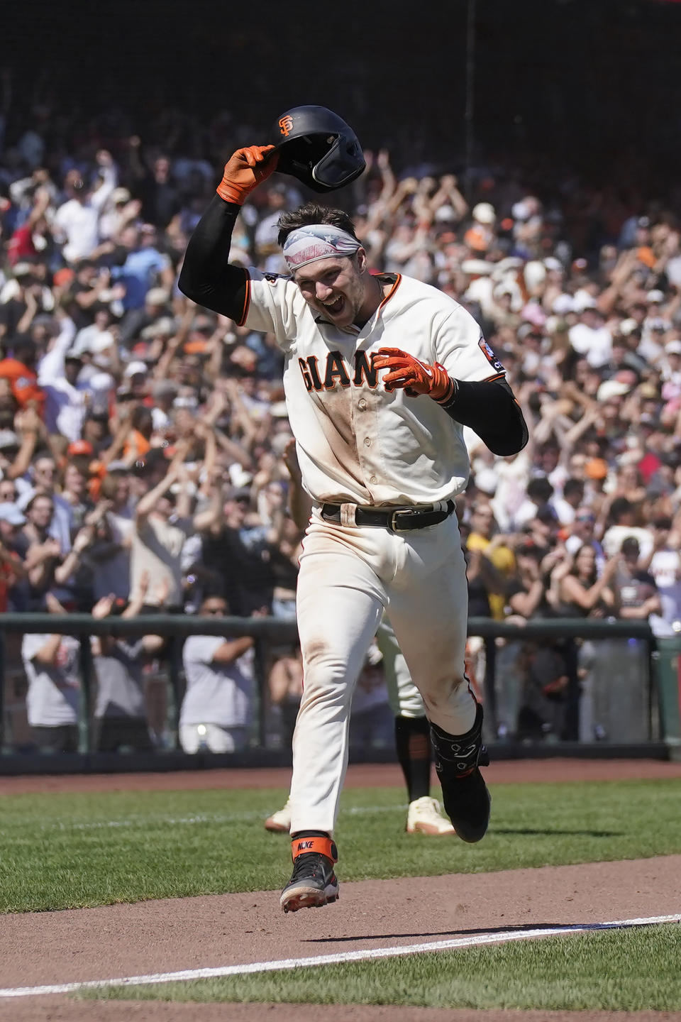 San Francisco Giants' Patrick Bailey celebrates after hitting a two-run home run during the tenth inning of a baseball game against the Texas Rangers in San Francisco, Sunday, Aug. 13, 2023. (AP Photo/Jeff Chiu)