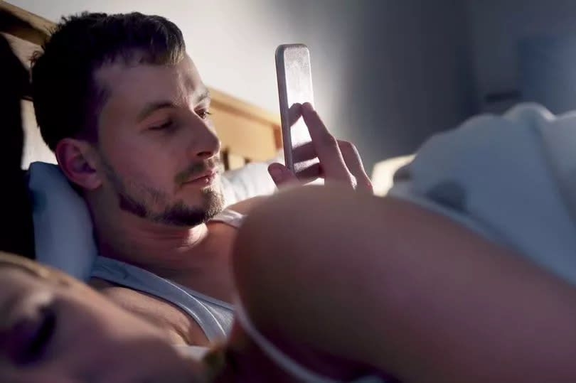 Stock photo of couple in bed