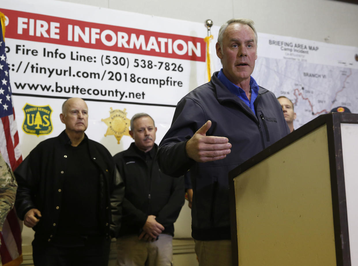 Secretary of the Interior Ryan Zinke, right, speaks at a news conference held with California Gov. Jerry Brown, left, after touring the fire ravaged town of Paradise, Calif., on Wednesday. (Photo: Rich Pedroncelli/AP)