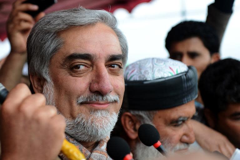 Photo taken on April 2, 2014 shows Afghan presidential candidate Abudullah Abdullah smiling during a political rally on the last day of campaigning by presidential candidates on the outskirts of Kabul