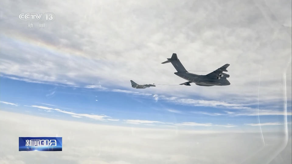 In this image taken from video footage run Saturday, April 8, 2023 by China's CCTV, a Chinese fighter jet performs an mid-air refueling maneuver at an unspecified location. The Chinese military announced exercises around Taiwan on Saturday in a new act of retaliation for a meeting between the U.S. House of Representatives speaker and the president of the self-ruled island democracy claimed by Beijing as part of its territory. (CCTV via AP)