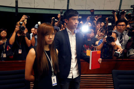 Pro-independence lawmakers Yau Wai-ching (L) and Baggio Leung stand during a demonstration at the Legislative Council in Hong Kong, China October 26, 2016. REUTERS/Bobby Yip