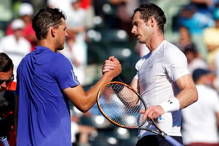 Apr 1, 2015; Key Biscayne, FL, USA; Andy Murray (R) shakes hands with Dominic Thiem (L) after their match on day ten of the Miami Open at Crandon Park Tennis Center. Murray won 3-6, 6-4, 6-1. Mandatory Credit: Geoff Burke-USA TODAY