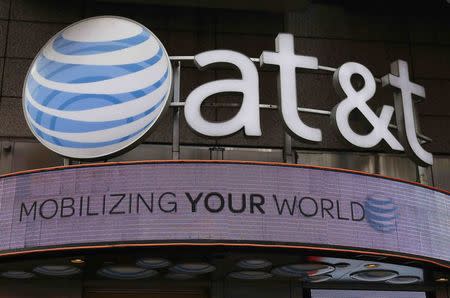 Signage for an AT&T store is seen in New York October 29, 2014. REUTERS/Shannon Stapleton/File Photo