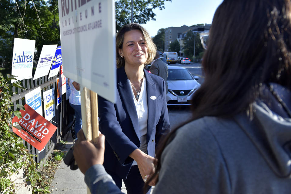 Mayoral Candidate City Councilor Annissa Essaibi George greets campaigners outside a polling place in the Roxbury neighborhood of Boston on Tuesday, Sept. 14, 2021 in a preliminary mayoral election that will select two top contenders from a field of five candidates all of whom are people of color, four of them women. (AP Photo/Josh Reynolds)