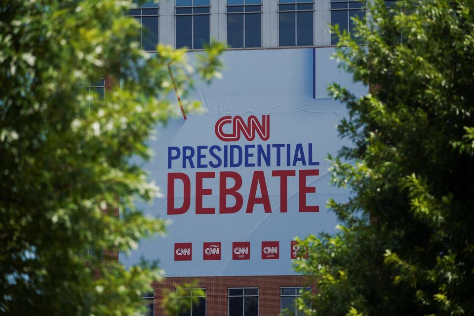 Signs promoting the debate between U.S. President Joe Biden and his rival Donald Trump are erected around the venue at CNN Center in Atlanta, Georgia, U.S. June 24, 2024.