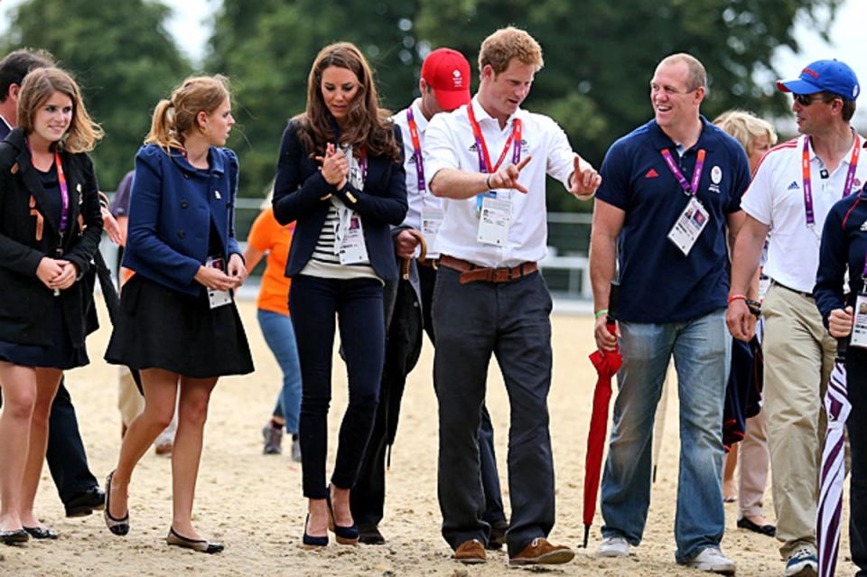 Members of the Royal family (left to right) Princess Eugenie, Princess Beatrice, The Duchess of Cambridg, Prince Harry, The Duke of Cambridge, Mike Tindall, Peter and Autumn Phillips after Great Britain's Zara Phillips won a Silver Medal in the Team Eventing at London 2012 (PA)