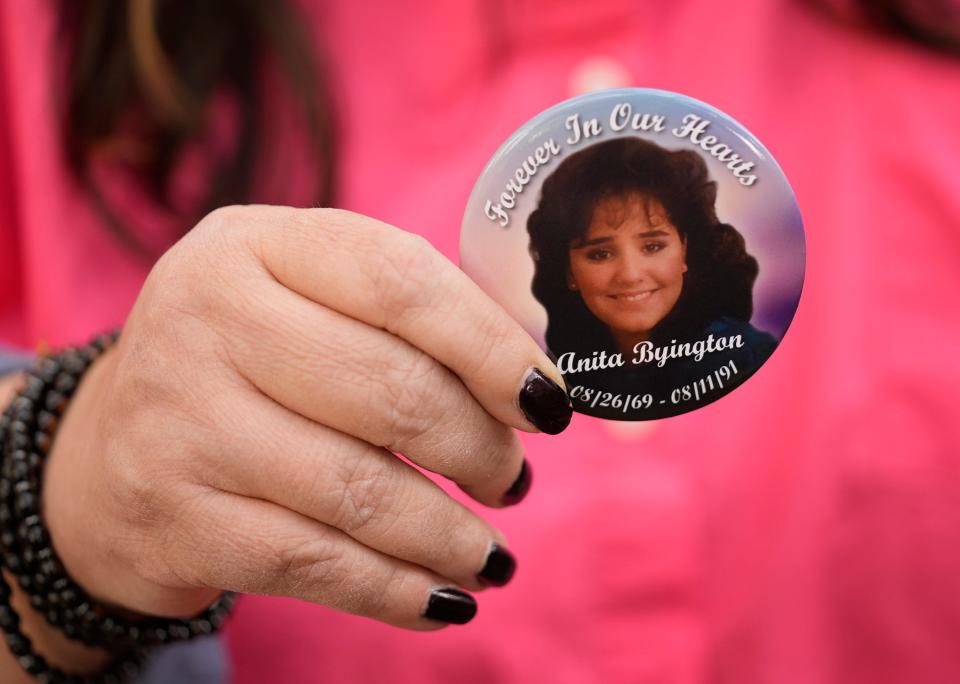 Kristina Byington displays a pin honoring her cousin Anita Byington. Kristina Byington accuses the district attorney’s office of failing to properly investigate Allen Andre Causey’s claim of innocence in Anita's slaying.