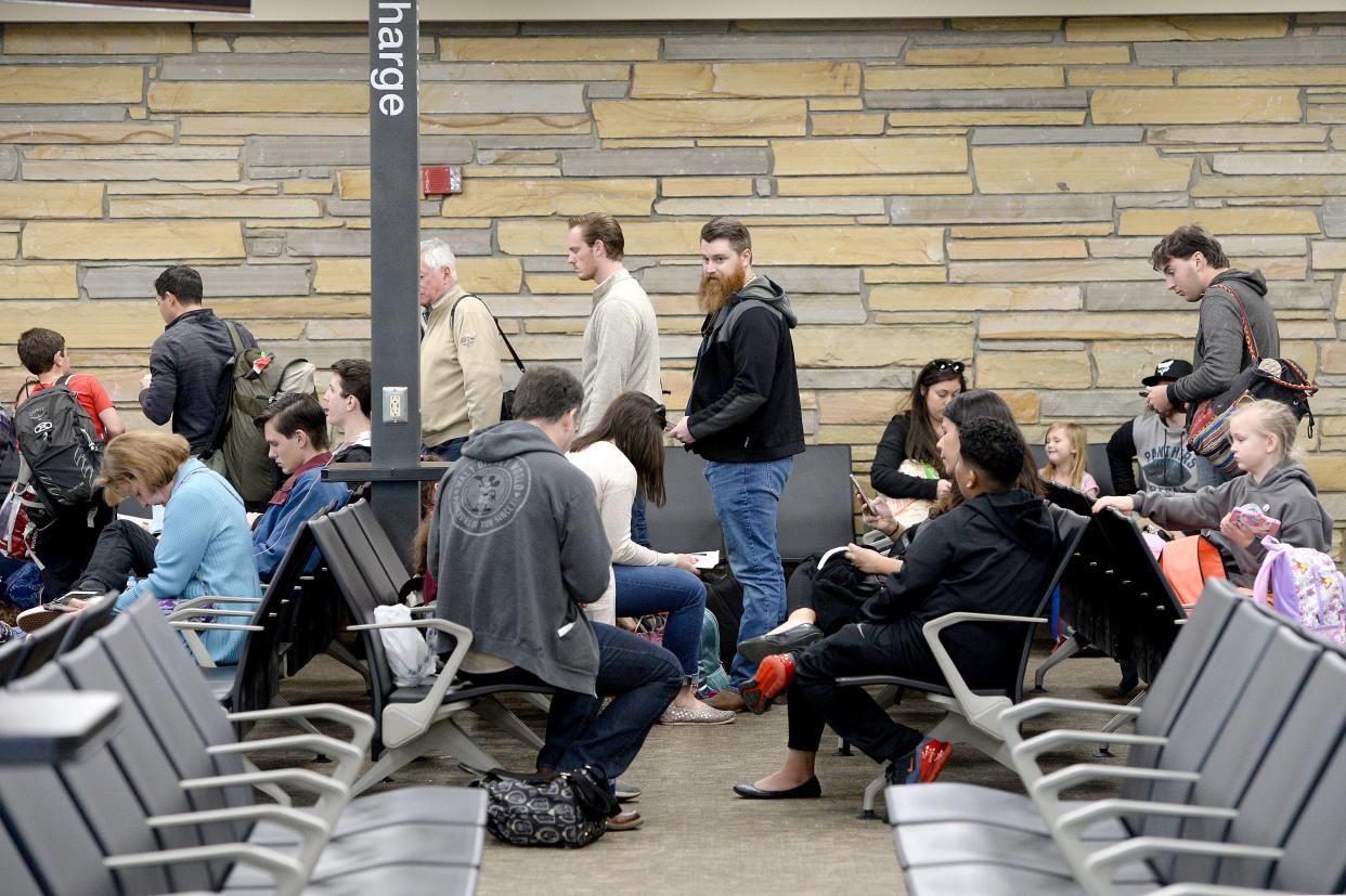 Travelers board a Spirit Airlines flight at the Asheville Regional Airport on March 27, 2019. 