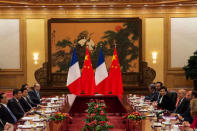 French Prime Minister Edouard Philippe listens to China's Premier Li Keqiang during a meeting at the Great Hall of the People in Beijing, China June 25, 2018. Fred Dufour/Pool via REUTERS