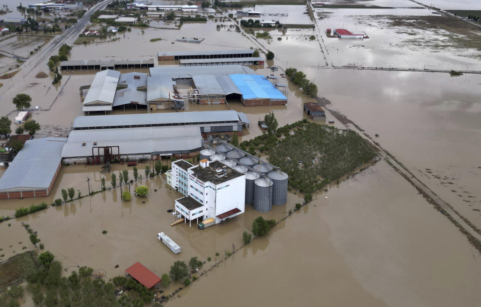 Floodwaters and mud cover the land after the country's record rainstorm, in Larissa, Thessaly region, central Greece, Thursday, Sept. 7, 2023. The death toll from severe rainstorms that lashed parts of Greece, Turkey and Bulgaria increased after rescue teams in the three neighboring countries recovered more bodies. (AP Photo/Vaggelis Kousioras)