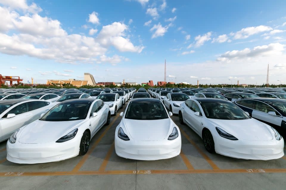 SHANGHAI, Oct. 19, 2020 -- Photo taken on Oct. 19, 2020 shows the Tesla China-made Model 3 vehicles which will be exported to Europe at Waigaoqiao port in Shanghai, east China, Oct. 19, 2020. U.S. carmaker Tesla announced on Monday that it would export the made-in-China Model 3 to Europe, marking another important milestone for its Shanghai Gigafactory. 
   The first batch of exported sedans will leave Shanghai next Tuesday and arrive at the port of Zeebrugge in Belgium at the end of November before being sold in European countries, including Germany, France, Italy, Spain, Portugal, and Switzerland. (Photo by Wang Xiang/Xinhua via Getty) (Xinhua/Wang Xiang via Getty Images)