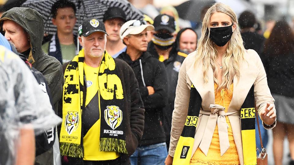 AFL fans, pictured here entering the Gabba before the 2020 AFL grand final.