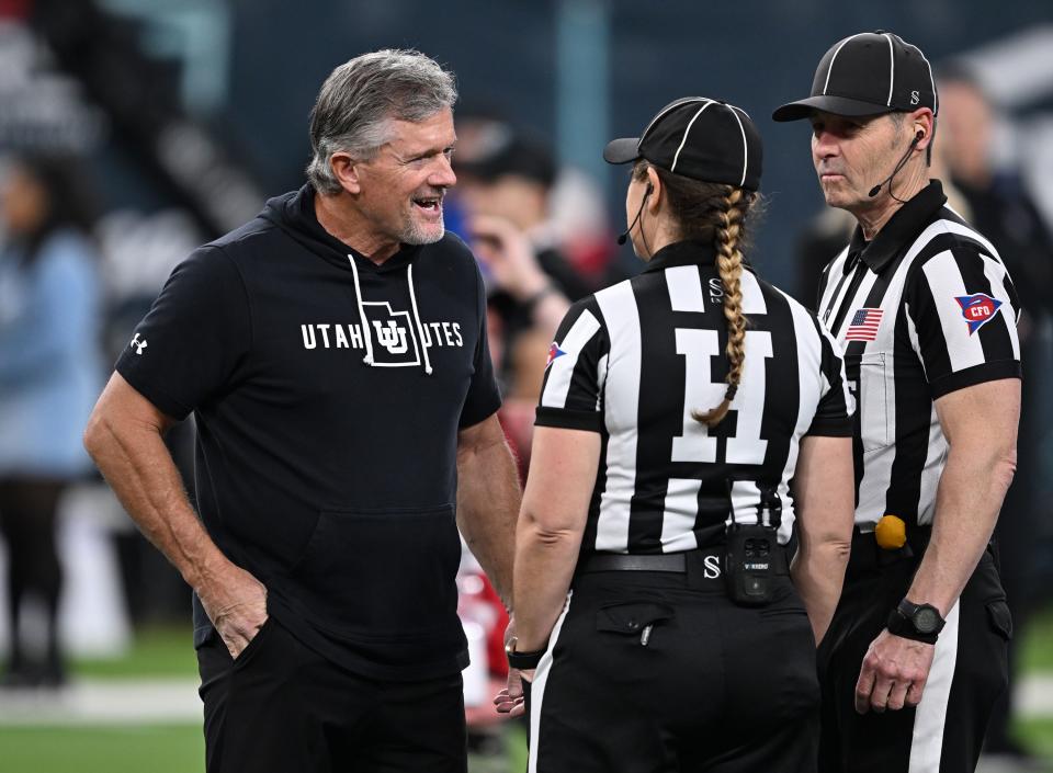 Utah Utes head coach Kyle Whittingham talks with a couple of the officials as Utah and Northwestern prepare to play in the SRS Distribution Las Vegas Bowl on Saturday, Dec. 23, 2023. | Scott G Winterton, Deseret News