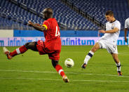 NASHVILLE, TN - MARCH 24: Perry Kitchen #4 of the USA takes a shot towards Nana Attakora-Gyan #4 of Canada in a 2012 CONCACAF Men's Olympic Qualifying match at LP Field on March 24, 2012 in Nashville, Tennessee. (Photo by Frederick Breedon/Getty Images)