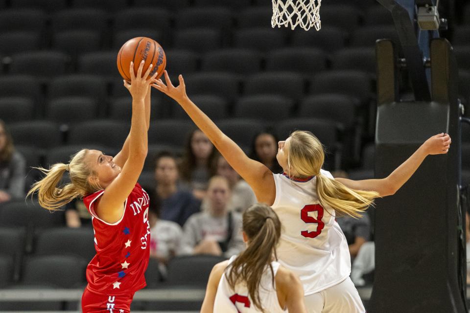 South Future All-Star Chloe Spreen (4), a junior from Bedford North Lawrence High School, and North Future All-Star Ava Ziolkowski (9), a junior from Crown Point High School, battle for a rebound during the first half of an girlsâ€™ Indiana High School Future All-Stars basketball game, Saturday, June 10, 2023, at Gainbridge Fieldhouse, in Indianapolis.