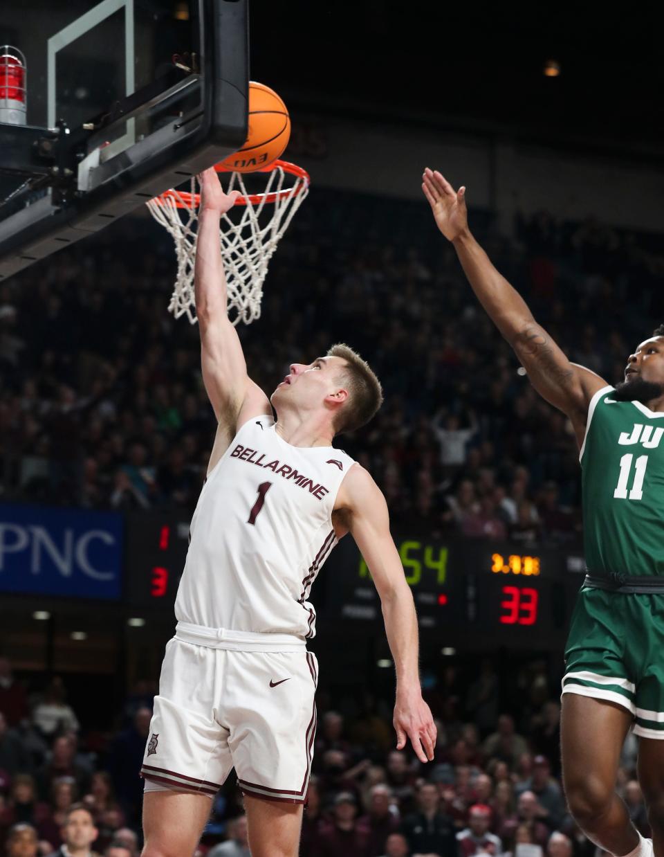 Bellarmine's Juston Betz (1) slips past the Jacksonville defense for a layup during the ASUN Championship game in Louisville, Ky.  on Mar.  8, 2022. Bellarmine won 77-72.