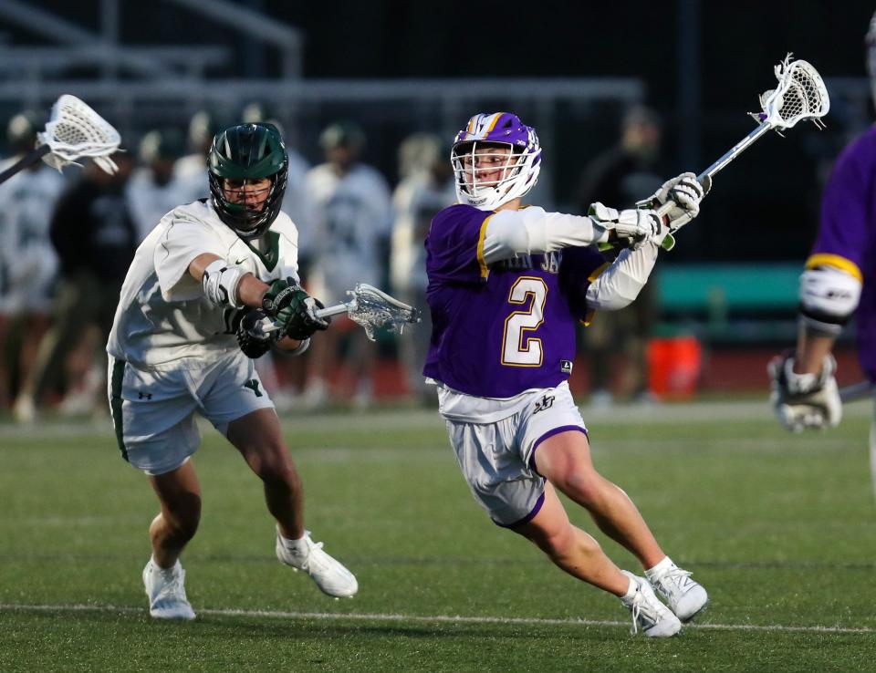 John Jay's Luca Duva (2) fires a shot for a second half goal against Yorktown during lacrosse action at Yorktown High School April 4, 2024. Yorktown won the game 8-7 in overtime.