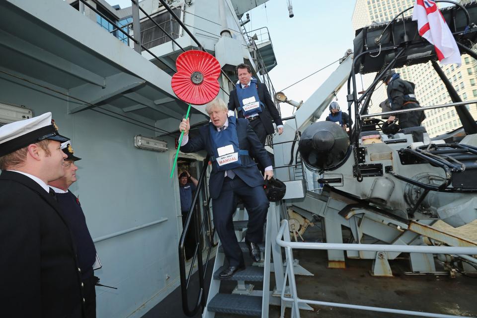 LONDON, ENGLAND - OCTOBER 30: Mayor of London Boris Johnson is winched on board HMS Severn to take part in a photocall on October 30, 2012 in London, England. Mr Johnson was taking part in the event to raise awareness of the Royal British Legion's Poppy Day appeal. This year will be the first time that customers can pay for a poppy using contactless technology on their credit cards. The money raised from the sale of the poppy badges will go towards the Royal British Legion's fund to support the armed forces. (Photo by Dan Kitwood/Getty Images)