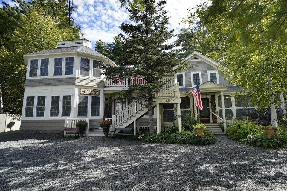 FILE— The Big Moose Inn is seen Friday, Sept. 18, 2020, near Millinocket, Maine. The inn was the setting for an Aug. 7 wedding reception that has since been linked to numerous cases of the coronavirus, and several deaths. Plans for a lawsuit against the Maine venue that hosted what became a "super spreader" wedding reception underscore the liability risks to small businesses amid the coronavirus pandemic and an uphill push by Republicans in Congress to give such outfits legal immunity. (AP Photo/Robert F. Bukaty, File)