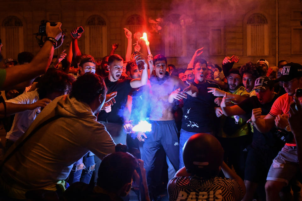 PARIS, FRANCE - AUGUST 19: PSG fans gathered in Champs Elysee to celebrate the winning in the UEFA Champions League semi-finals in Paris, France on August 19, 2020. Police take security measures around the site. France's Paris Saint-Germain has reached the UEFA Champions League final for the first time after beating German side RB Leipzig 3-0 Tuesday. (Photo by Julien Mattia/Anadolu Agency via Getty Images)