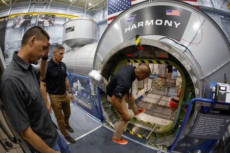 NASA commercial crew astronauts Michael Hopkins and Victor Glover run through a training session at a replica International Space Station (ISS) at the Johnson Space Center in Houston, Texas