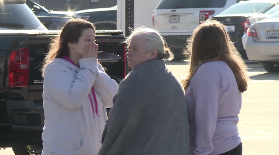 Family and friends of Amethyst Killian, 22, cry outside a crime scene in Missouri.
