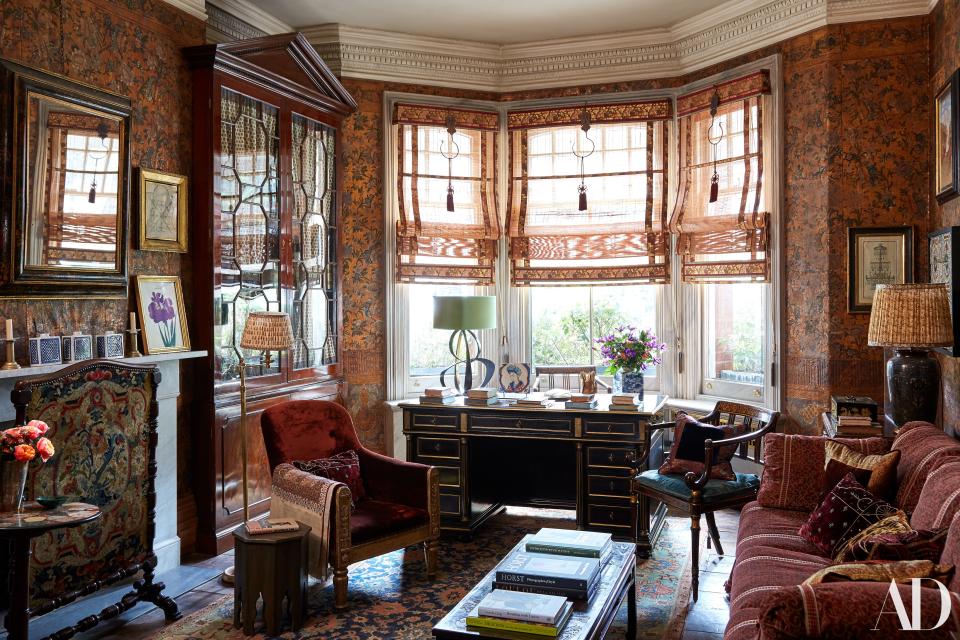 In the otherwise antiques-laden living room, an Hervé Van Der Straeten lamp stands out atop a 19th-century French desk. Japanese sudare shades; English (left) and Italian armchairs.