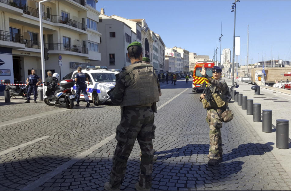 <p>Armed soldiers on the scene after a van rammed into two bus stops in Marseille, France, Aug. 21, 2017. (Photo: David Coquille/AP) </p>