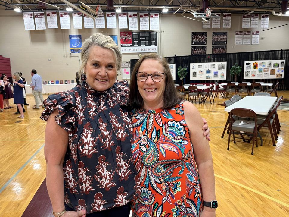 Beth Abee, left, and Lori West enjoy the 25th anniversary celebration inside West Valley Middle School’s gymnasium on May 14, 2024. The two are the only two original faculty members remaining on the staff.