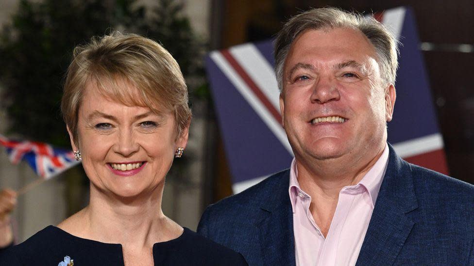 Yvette Cooper and Ed Balls stand smiling together on the red carpet at the Pride of Britain Awards 2022