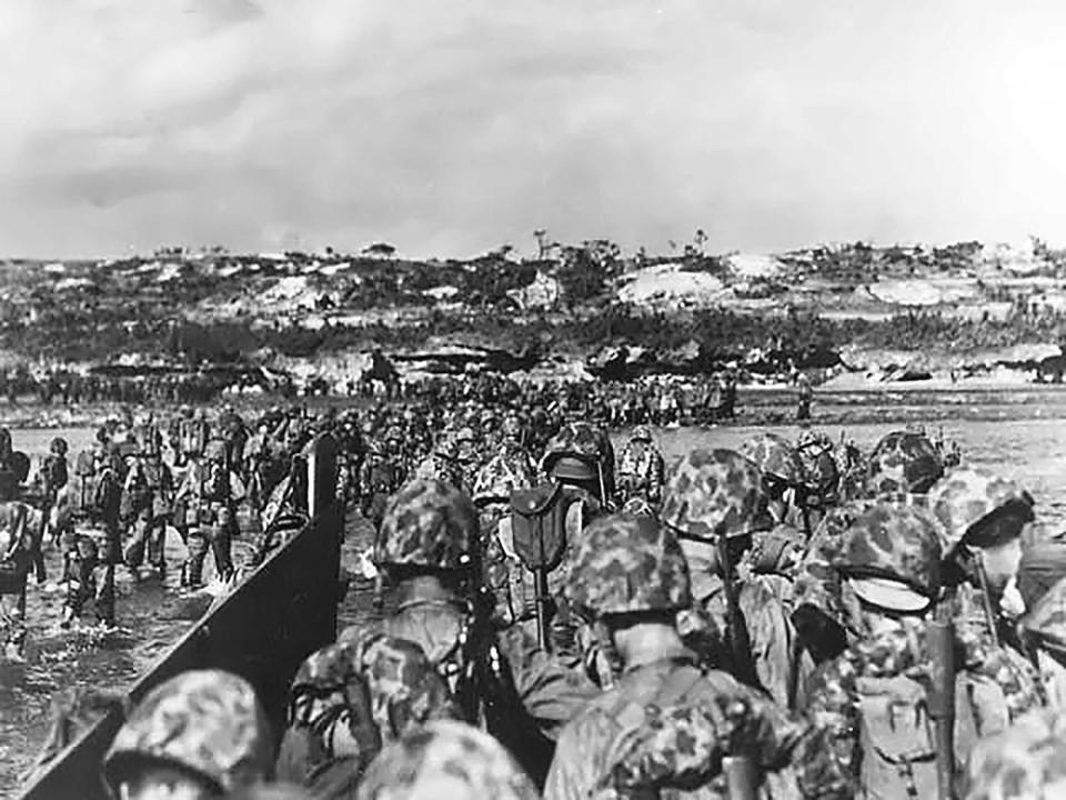 U.S. Marine reinforcements wade ashore to support the beachhead on Okinawa, April 1, 1945.