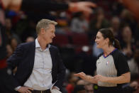 Referee Lauren Holtkamp-Sterling right, talks with Golden State Warriors coach Steve Kerr during the first half of the team's NBA basketball game against the Chicago Bulls on Friday, Dec. 6, 2019, in Chicago. This is Holtkamp-Sterling's first game since giving birth to a daughter. (AP Photo/Paul Beaty)