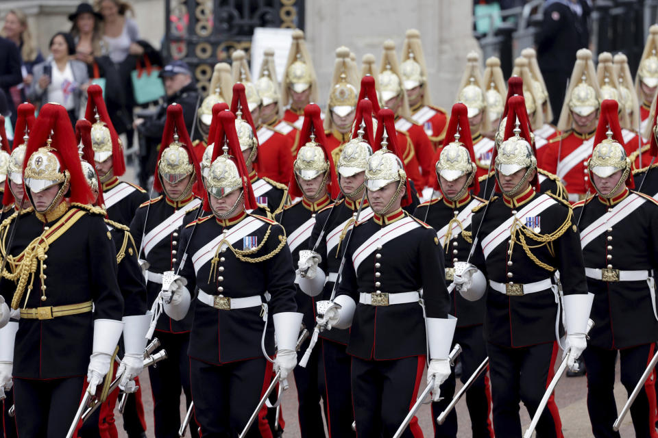 Members of the Household Cavalry march ahead, during the Platinum Jubilee Pageant outside Buckingham Palace in London, Sunday June 5, 2022, on the last of four days of celebrations to mark the Platinum Jubilee. The pageant will be a carnival procession up The Mall featuring giant puppets and celebrities that will depict key moments from Queen Elizabeth II’s seven decades on the throne. (Chris Jackson/Pool Photo via AP)